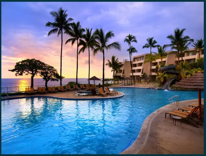 Resort pool among palm trees in Hawaii