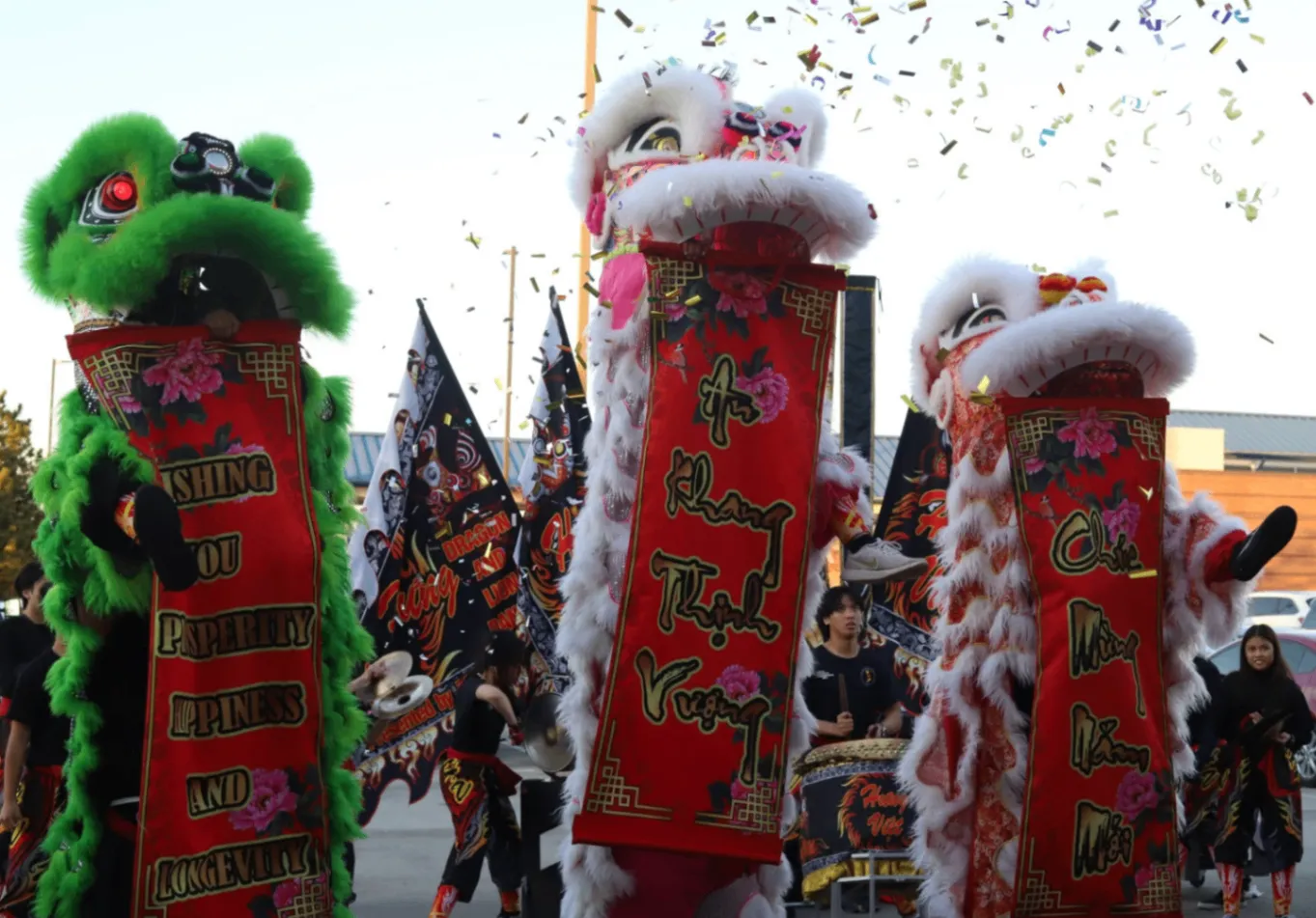 A colorful lion dance procession with performers